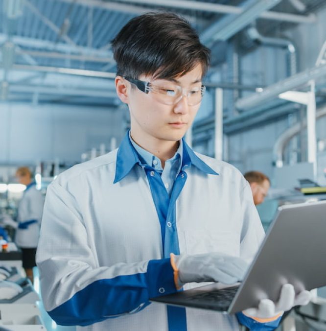 hightech-factory-asian-engineer-uses-laptop-computer-programing-pick-place-electronic-machinery-printed-circuit-board-surface-mount-assembly-line-production-pcb-with-smt-machinery